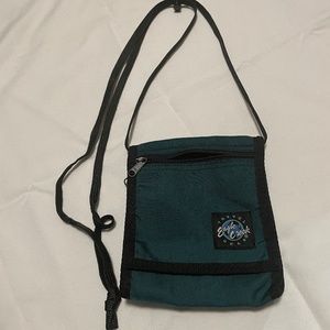 Eagle Creek green and black tri-fold crossbody bag